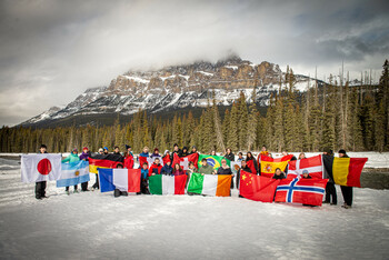 students holding flags of different countries