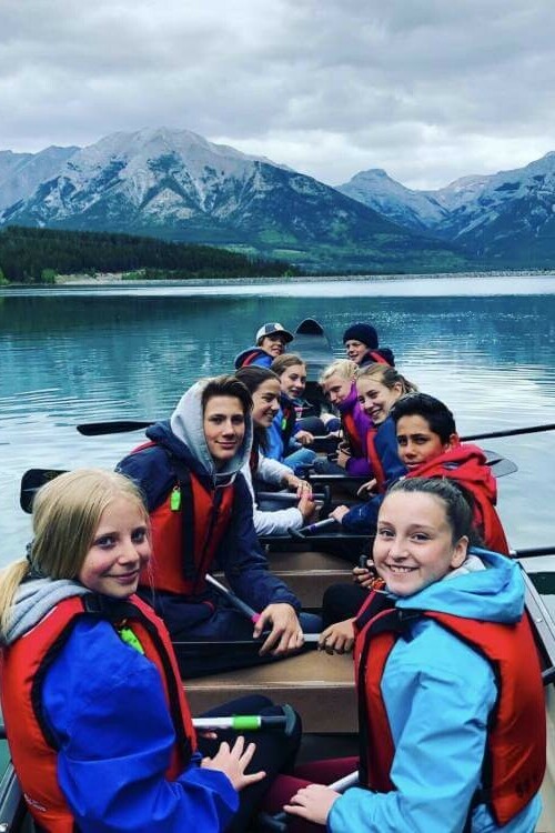 group of students canoeing